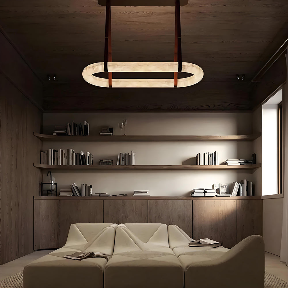 Light and shadow sculpture: A round alabaster chandelier illuminates the space with a gentle, poetic touch.