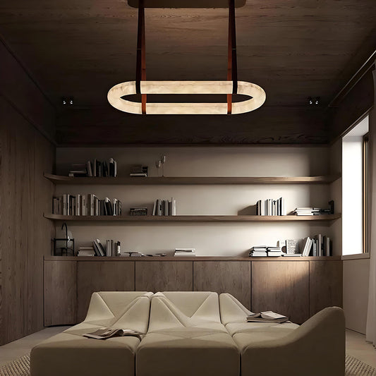 Light and shadow sculpture: A round alabaster chandelier illuminates the space with a gentle, poetic touch.