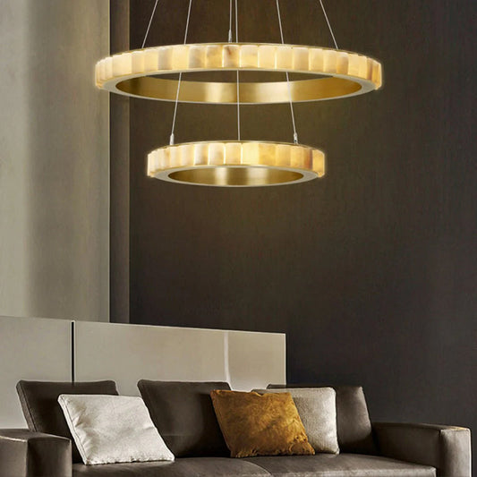 Two-tier ring-shaped alabaster chandelier installed in a contemporary living room